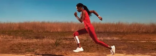 Lady running through a desert in a race