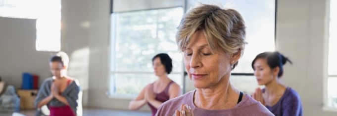 Older lady meditating.