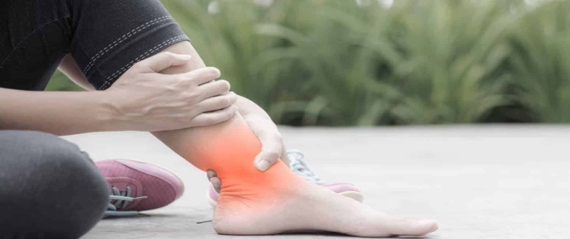 Lady rubbing swollen ankles