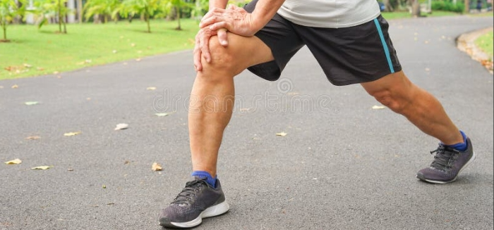 Mans leg in sports shoe.