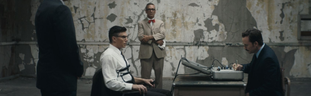 Man in suit in a mind control experiment