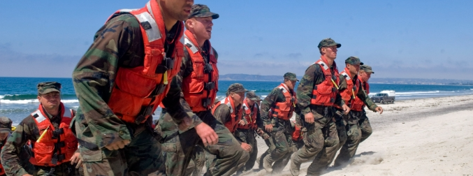 Soldiers running up a beach